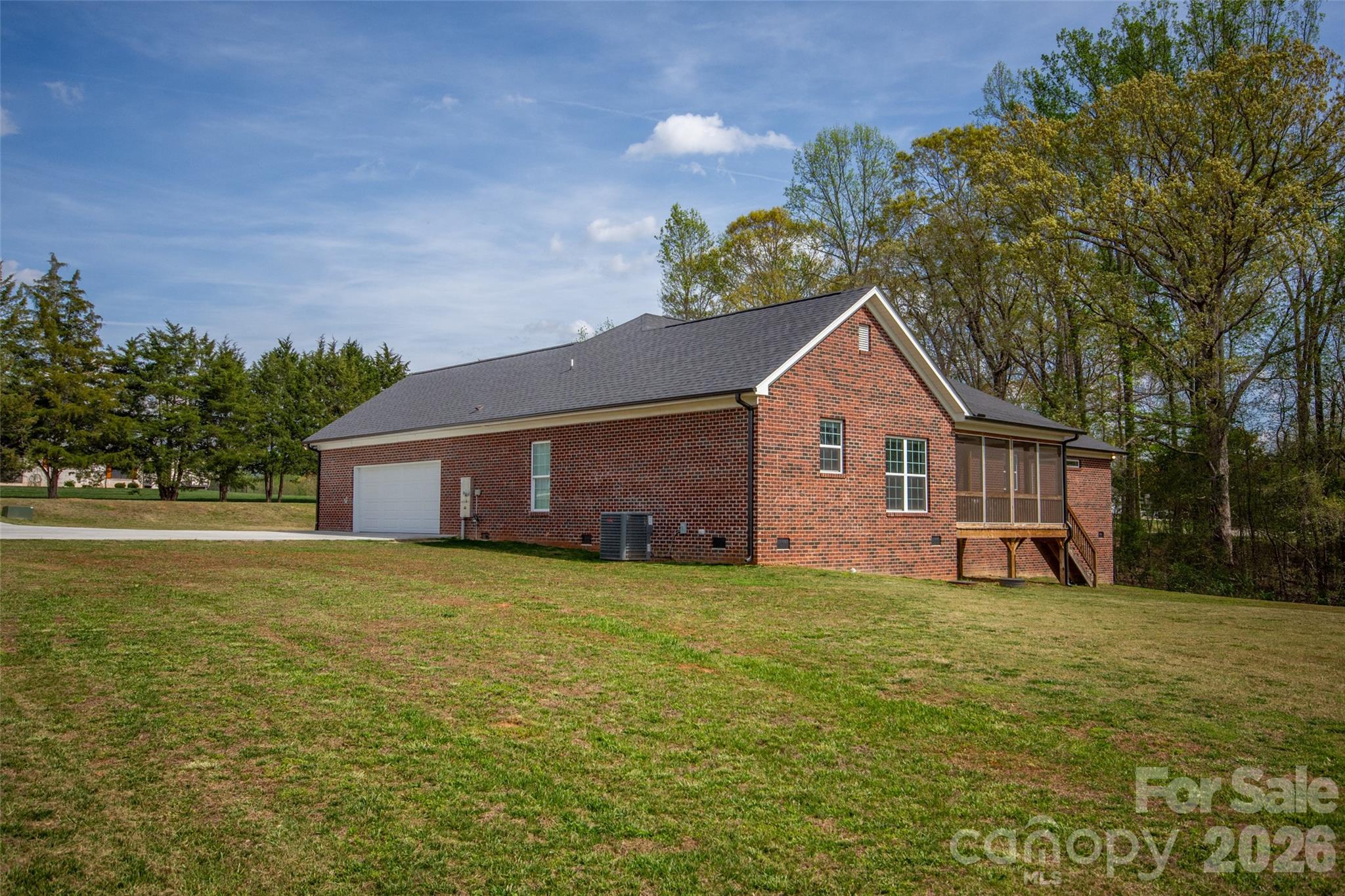 540 New Salem Road, Unit 1011 Statesville, NC 28625 - Photo 34 of 36 a front view of house with yard and trees in the background