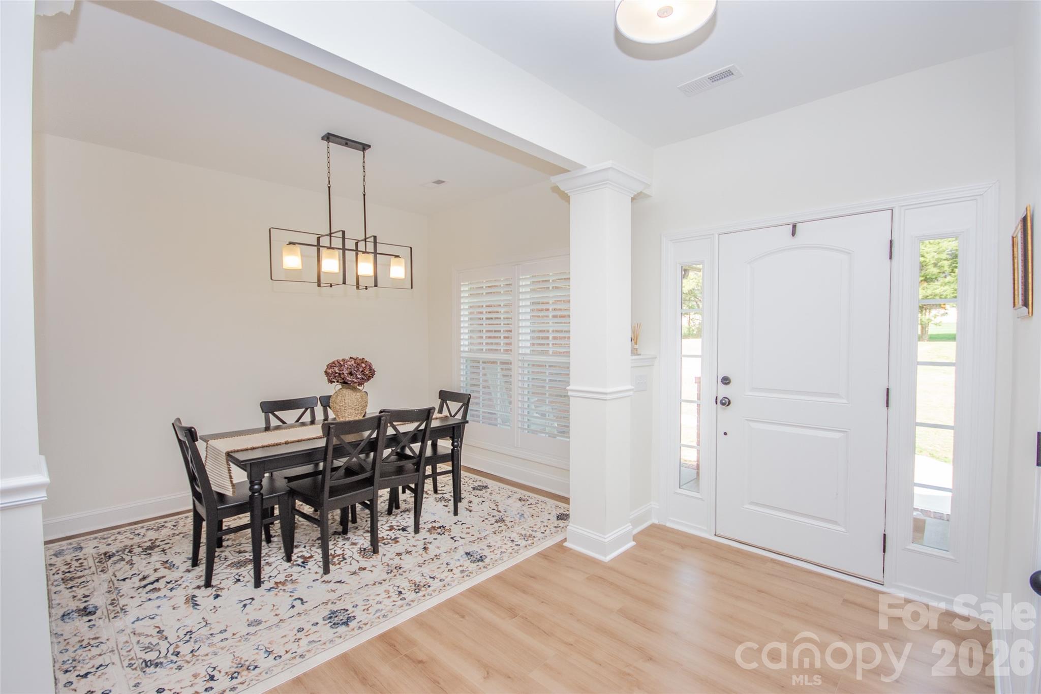 540 New Salem Road, Unit 1011 Statesville, NC 28625 - Photo 4 of 36 a view of a dining room with furniture