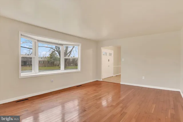 a kitchen with a refrigerator sink and cabinets