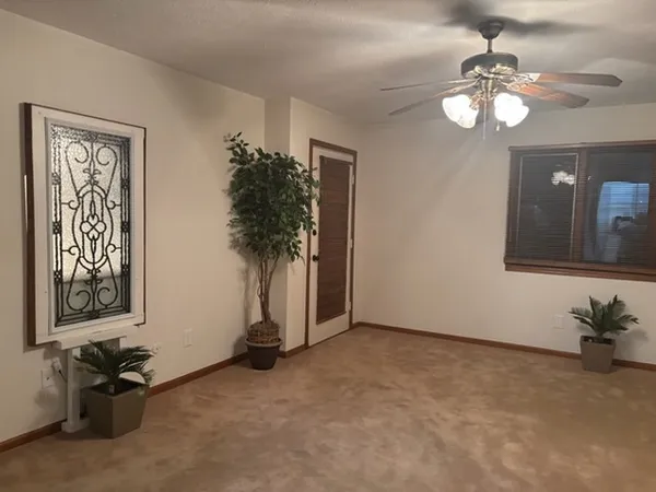 a view of a livingroom with furniture and a chandelier