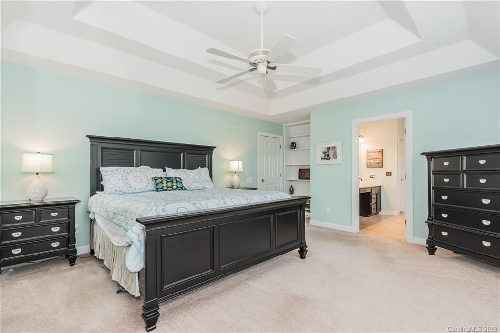 3310 Blue Jay Pass Fort Mill, SC 29708 - Photo 19 of 40 a bedroom with a bed and a dresser