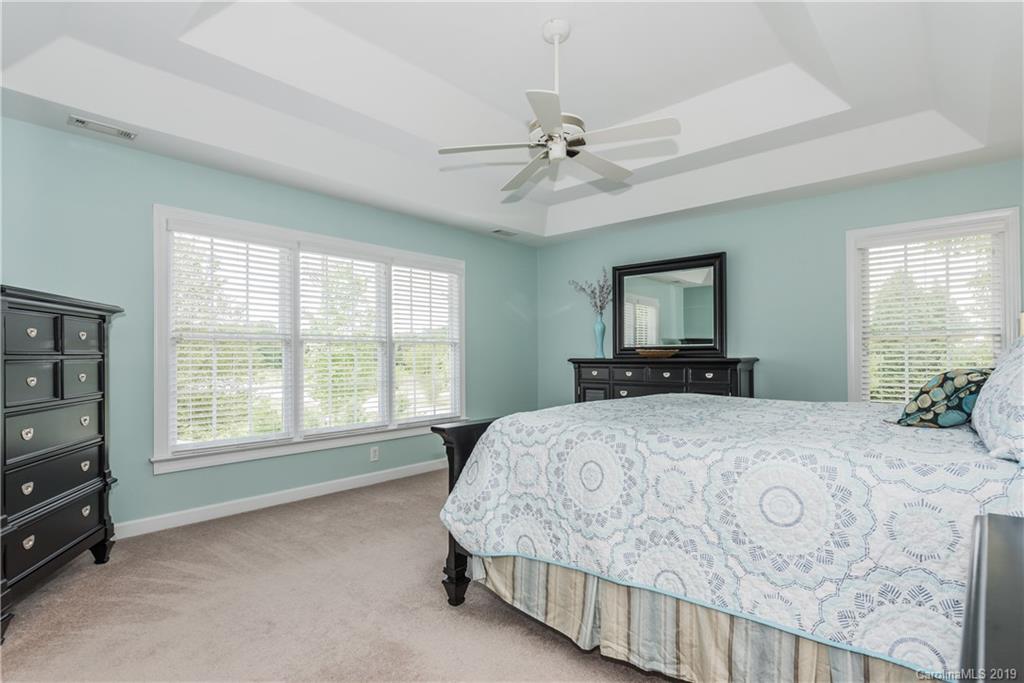 3310 Blue Jay Pass Fort Mill, SC 29708 - Photo 20 of 40 a bedroom with a large bed and a tv