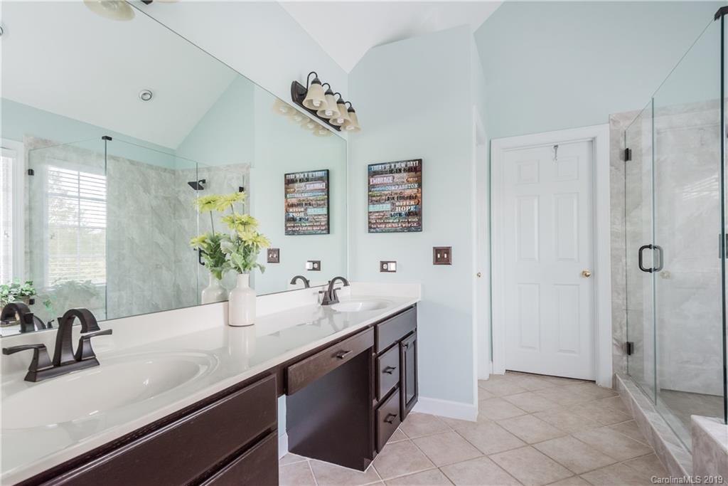 3310 Blue Jay Pass Fort Mill, SC 29708 - Photo 21 of 40 a bathroom with a sink double vanity and a mirror