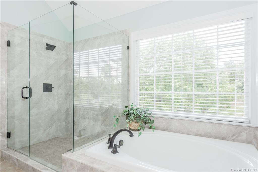 3310 Blue Jay Pass Fort Mill, SC 29708 - Photo 22 of 40 a bathroom with a bathtub and shower