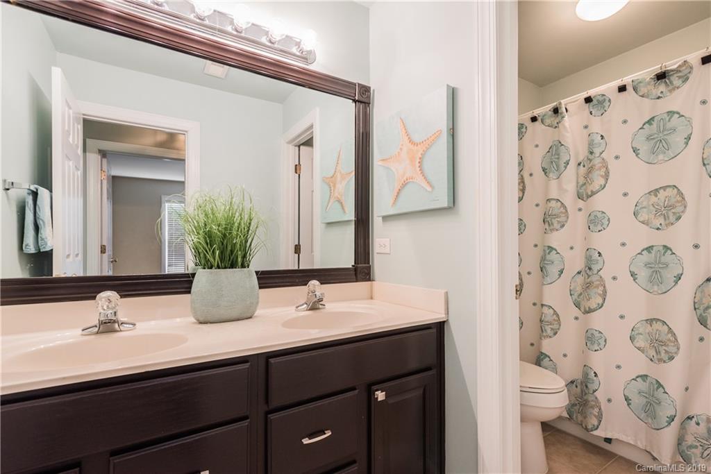 3310 Blue Jay Pass Fort Mill, SC 29708 - Photo 27 of 40 a bathroom with a sink and a mirror