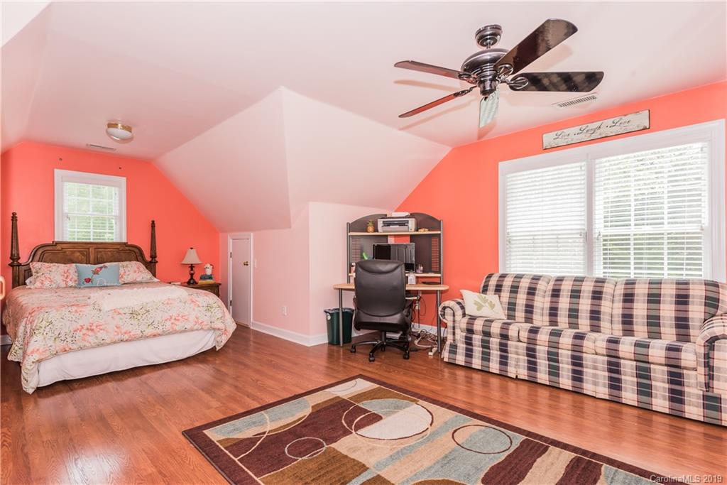 3310 Blue Jay Pass Fort Mill, SC 29708 - Photo 28 of 40 a bedroom with a bed and wooden floor