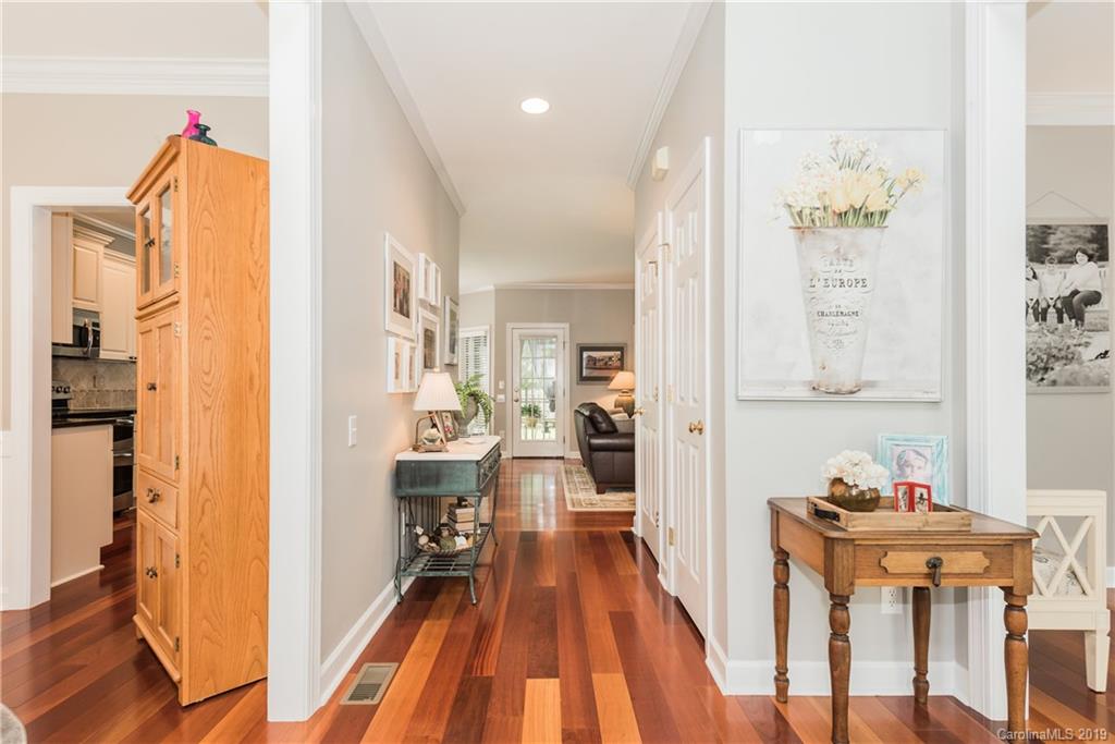 3310 Blue Jay Pass Fort Mill, SC 29708 - Photo 5 of 40 a view of a hallway with furniture and wooden floor