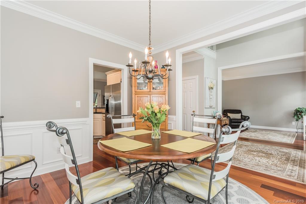 3310 Blue Jay Pass Fort Mill, SC 29708 - Photo 9 of 40 a dining room with furniture a chandelier and window