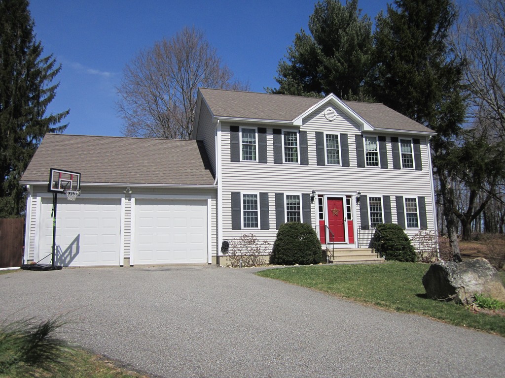 3 A Oakham Road North Brookfield, MA 01535 - Photo 1 of 26 a front view of a house with a yard and garage