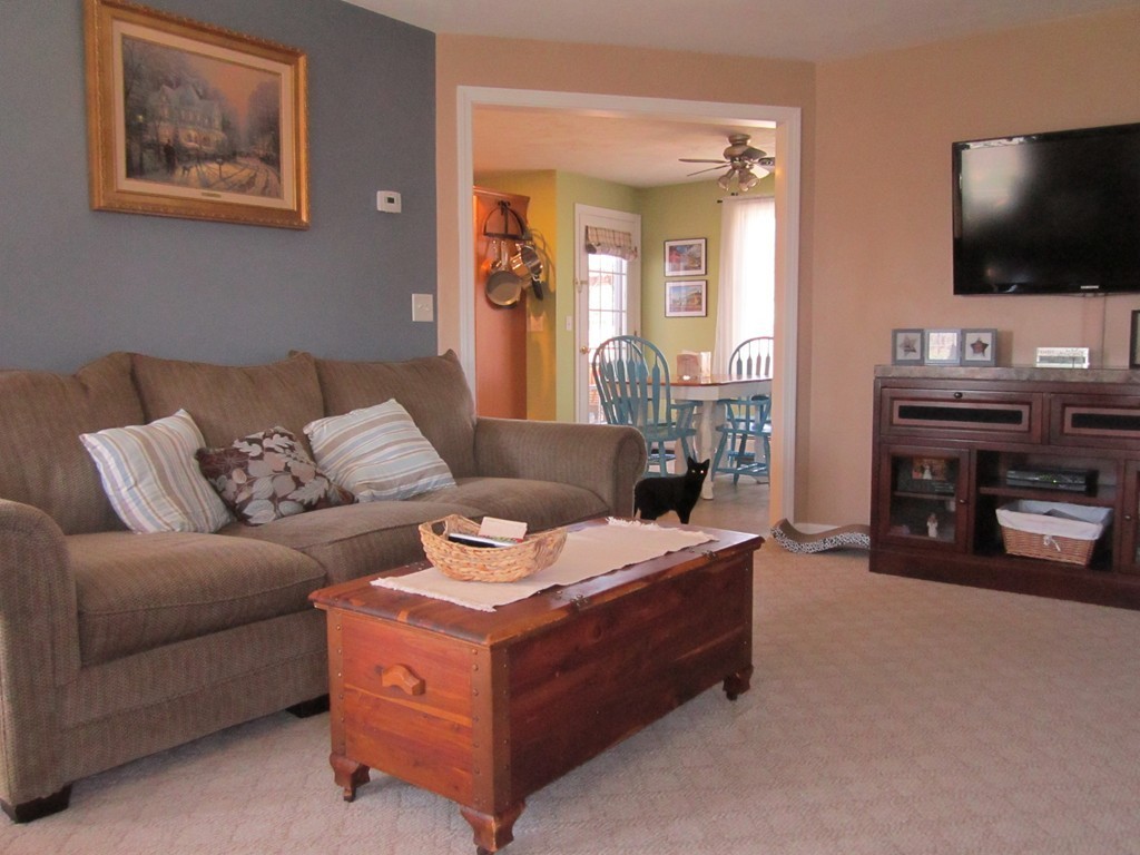 3 A Oakham Road North Brookfield, MA 01535 - Photo 13 of 26 a living room with furniture and a flat screen tv