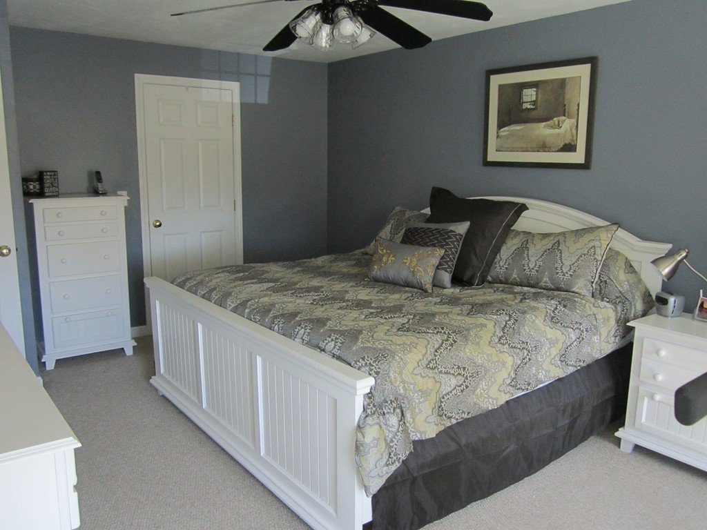 3 A Oakham Road North Brookfield, MA 01535 - Photo 15 of 26 a bedroom with a bed and a refrigerator
