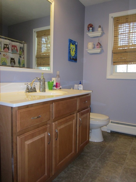 3 A Oakham Road North Brookfield, MA 01535 - Photo 18 of 26 a bathroom with a toilet sink and mirror