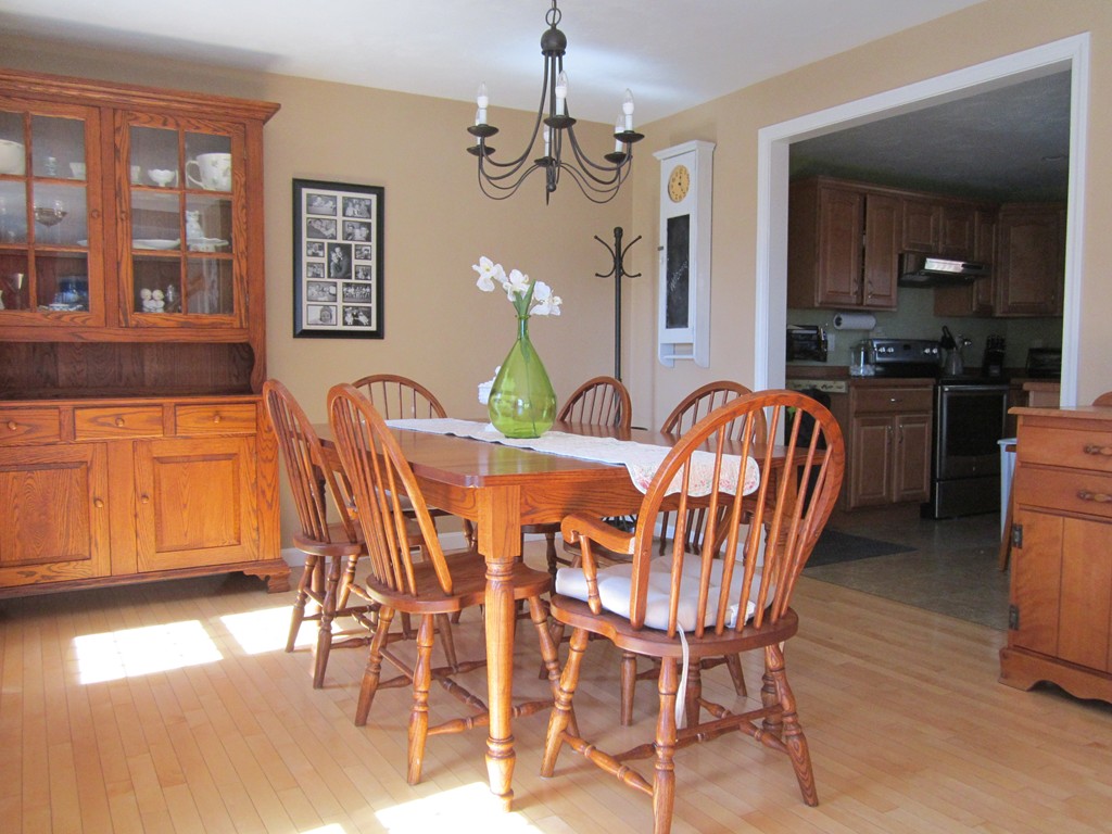 3 A Oakham Road North Brookfield, MA 01535 - Photo 2 of 26 a dining room with furniture a chandelier and wooden floor