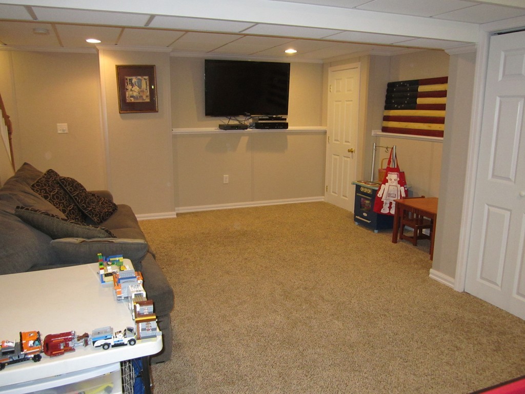 3 A Oakham Road North Brookfield, MA 01535 - Photo 21 of 26 a living room with furniture and a flat screen tv