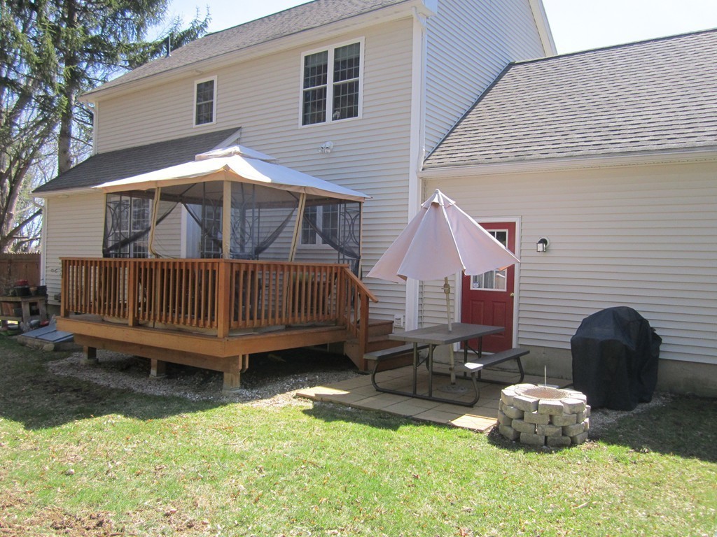 3 A Oakham Road North Brookfield, MA 01535 - Photo 22 of 26 a backyard of a house with a yard fire pit and outdoor seating