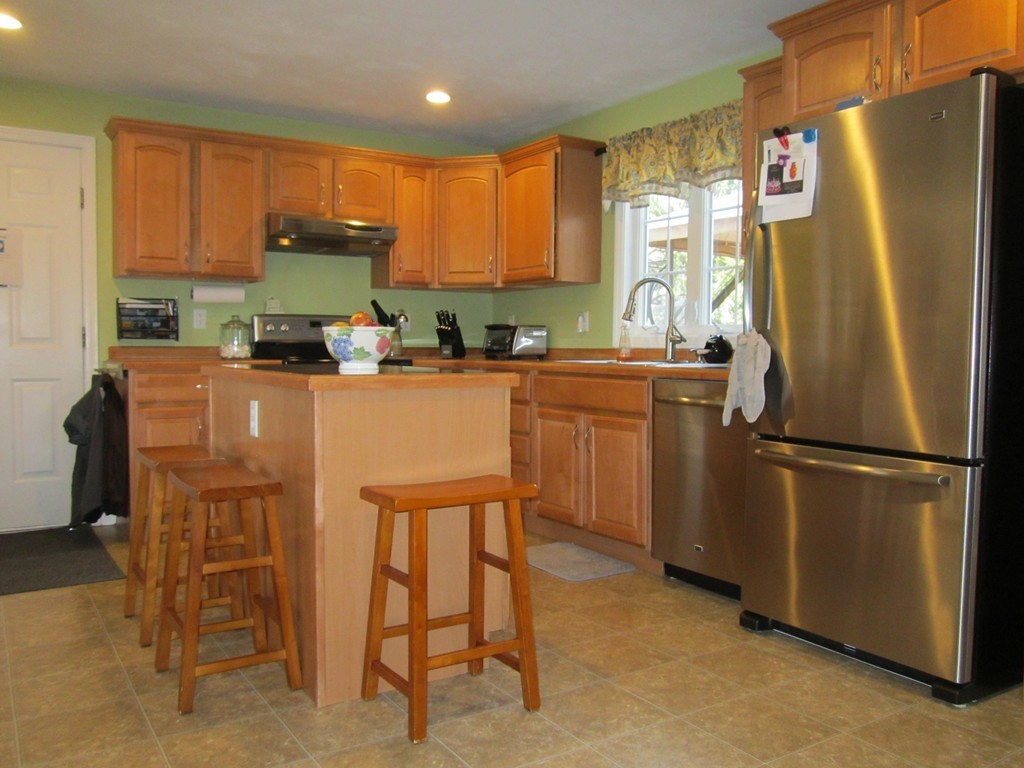 3 A Oakham Road North Brookfield, MA 01535 - Photo 9 of 26 a kitchen with stainless steel appliances a refrigerator sink and cabinets