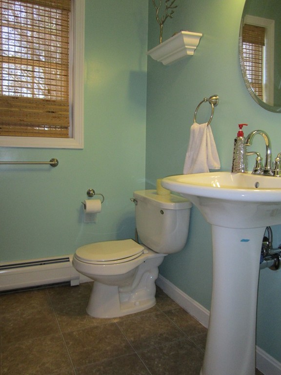 3 A Oakham Road North Brookfield, MA 01535 - Photo 10 of 26 a bathroom with a toilet sink and mirror