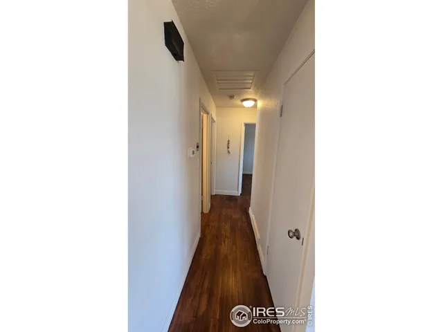 a view of a hallway with a white walls