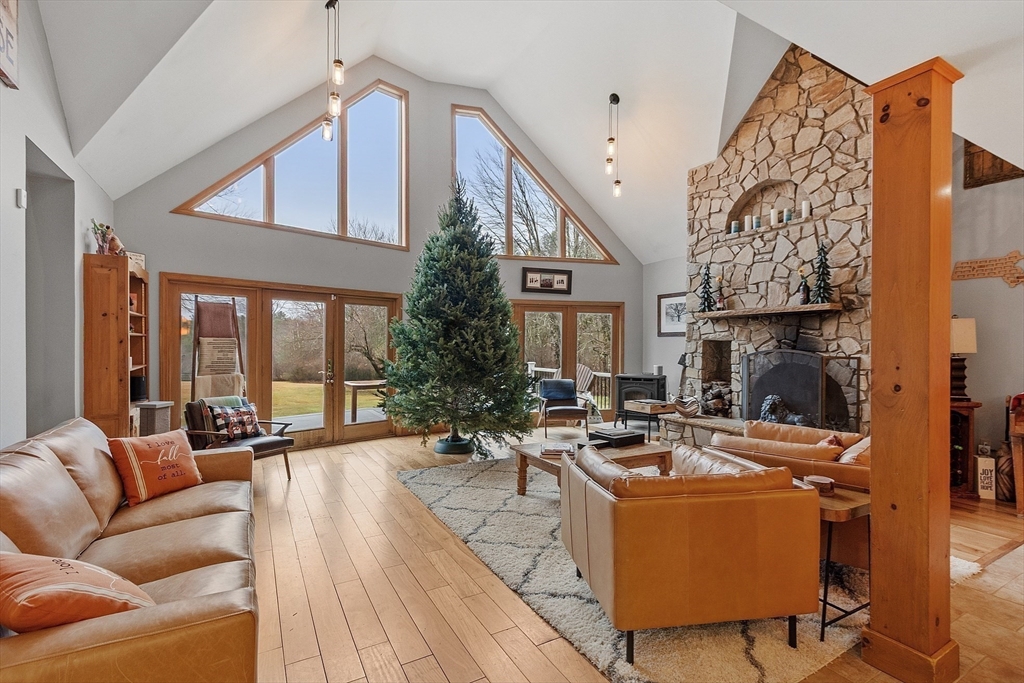 287 Chapman Road, Unit 1 Barre, MA 01005 - Photo 1 of 38 a living room with patio furniture and a fireplace