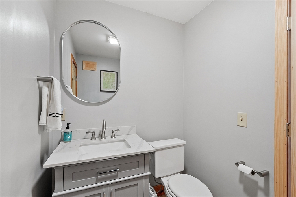 287 Chapman Road, Unit 1 Barre, MA 01005 - Photo 13 of 38 a bathroom with a toilet a sink and mirror