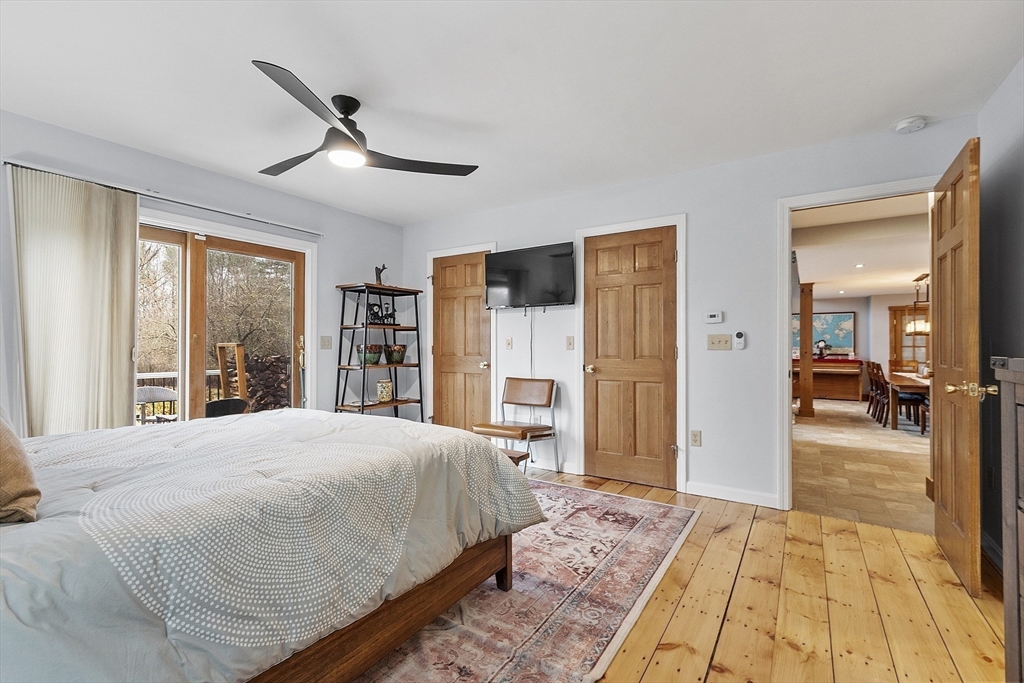 287 Chapman Road, Unit 1 Barre, MA 01005 - Photo 15 of 38 a bedroom with a large bed and a large window