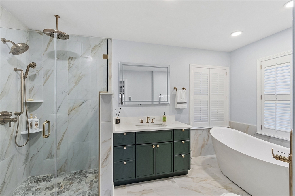 287 Chapman Road, Unit 1 Barre, MA 01005 - Photo 16 of 38 a bathroom with a tub sink double vanity granite and shower