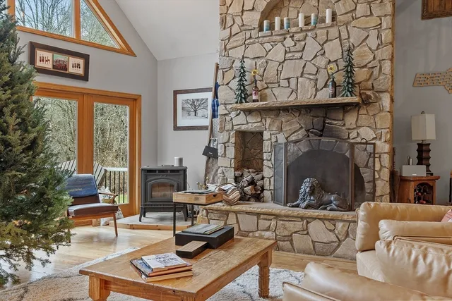 a living room with furniture a window and potted plants