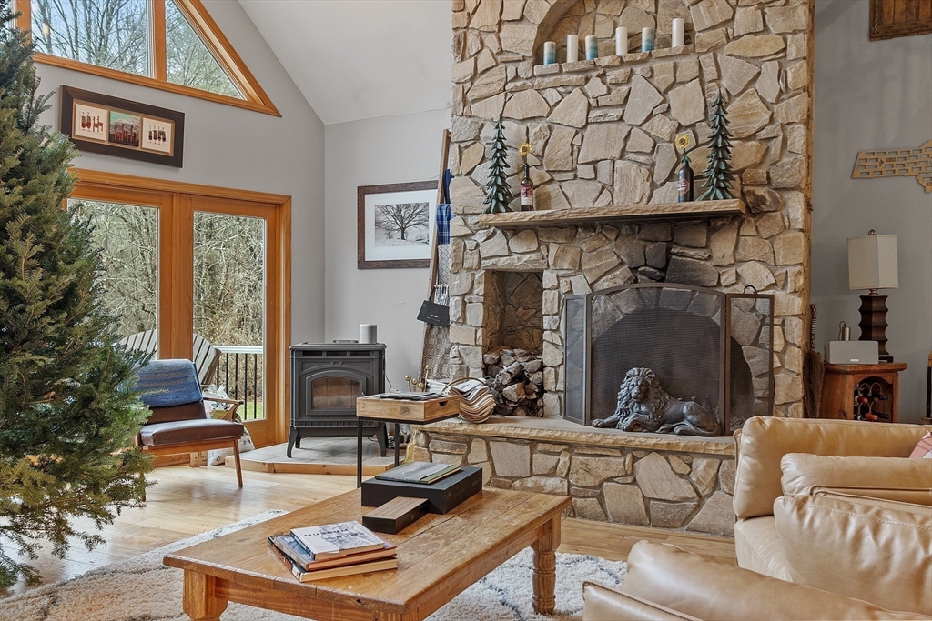 287 Chapman Road, Unit 1 Barre, MA 01005 - Photo 18 of 38 a living room with furniture and a fireplace