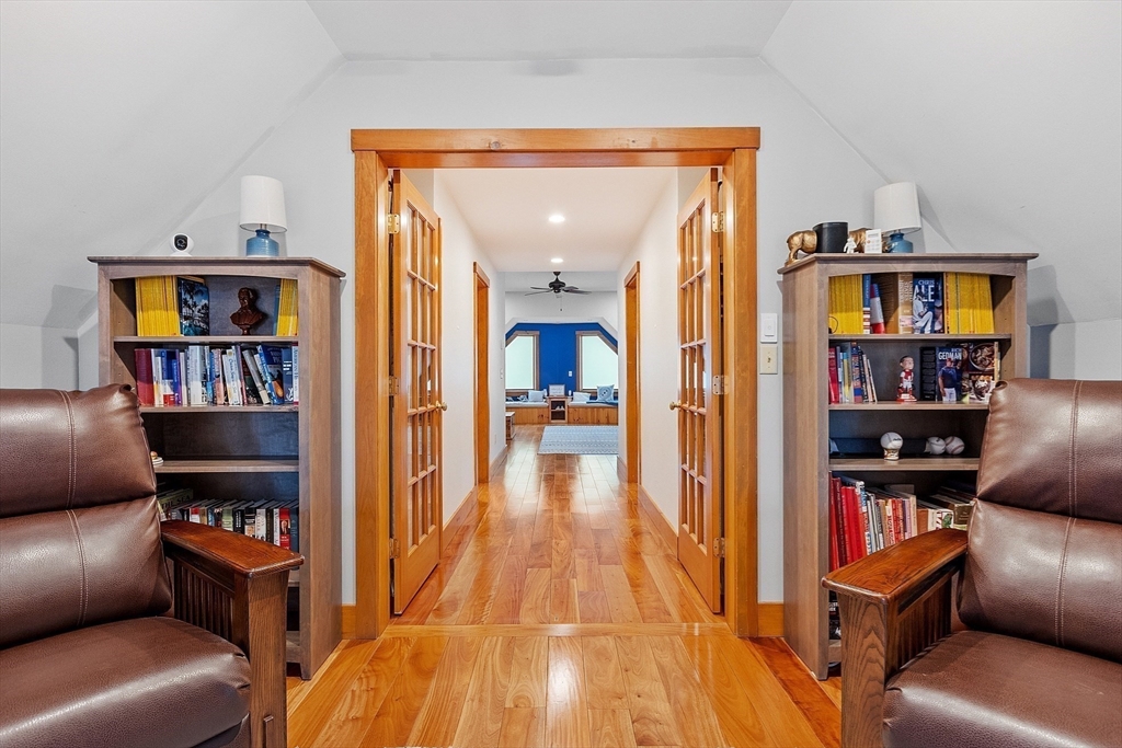 287 Chapman Road, Unit 1 Barre, MA 01005 - Photo 23 of 38 a living room with furniture and a book shelf