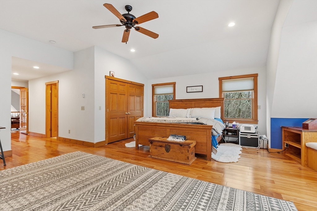 287 Chapman Road, Unit 1 Barre, MA 01005 - Photo 26 of 38 a bedroom with a bed and wooden floor