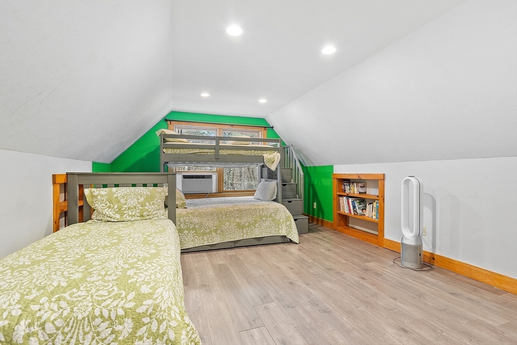 287 Chapman Road, Unit 1 Barre, MA 01005 - Photo 27 of 38 a bedroom with a bed and a large window