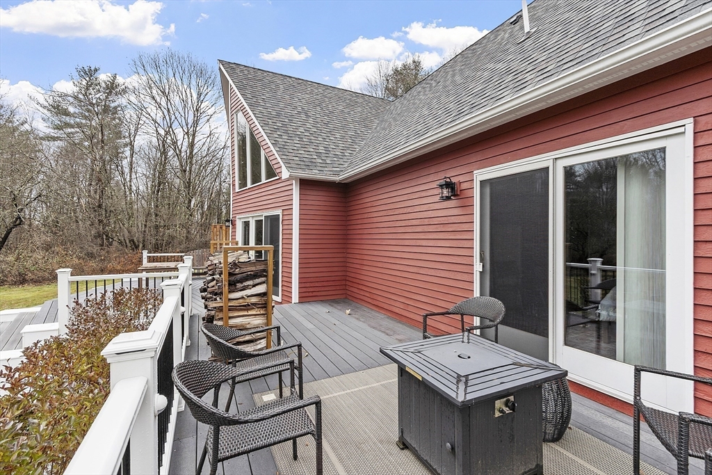 287 Chapman Road, Unit 1 Barre, MA 01005 - Photo 33 of 38 a balcony with table and chairs