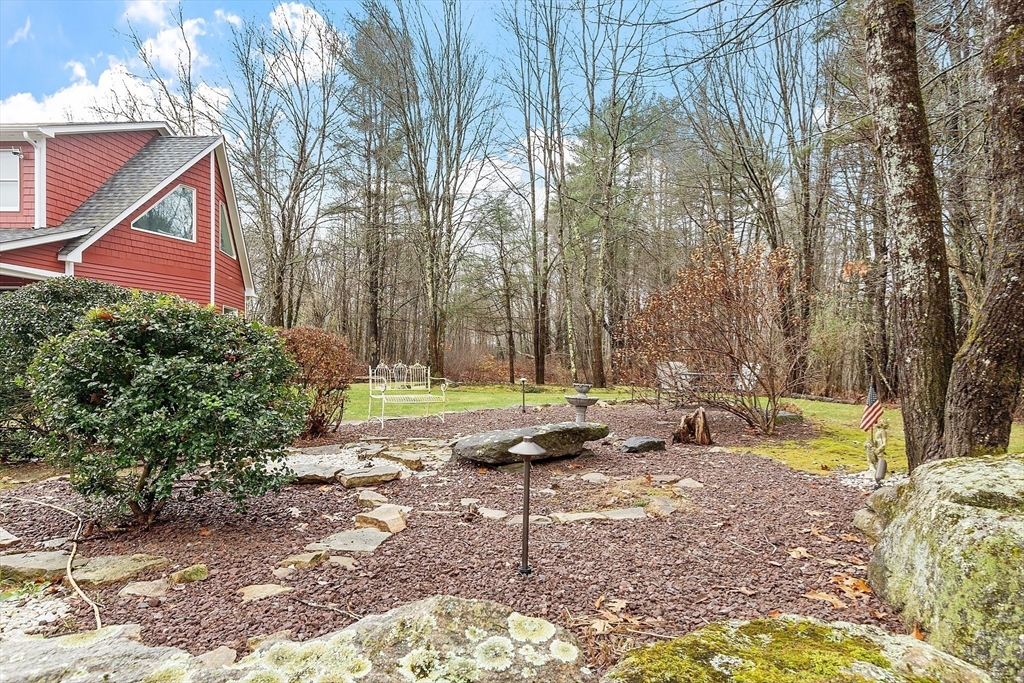 287 Chapman Road, Unit 1 Barre, MA 01005 - Photo 35 of 38 a view of a backyard with sitting area