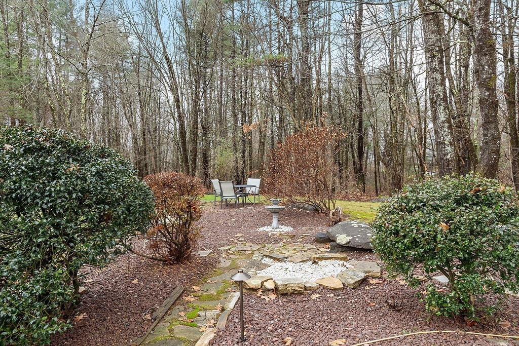 287 Chapman Road, Unit 1 Barre, MA 01005 - Photo 36 of 38 a view of a backyard with large trees