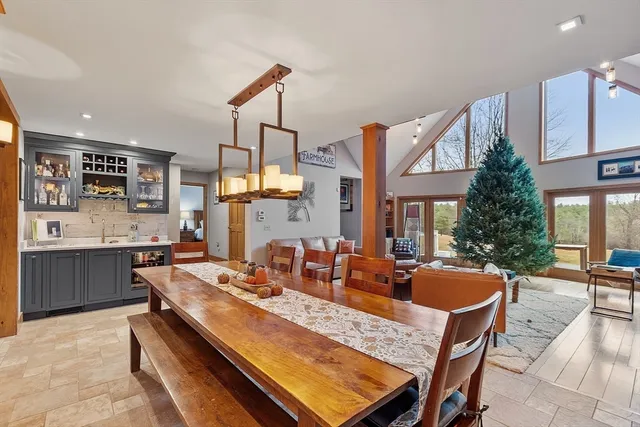 a view of a dining room kitchen counter top space a sink and living room view