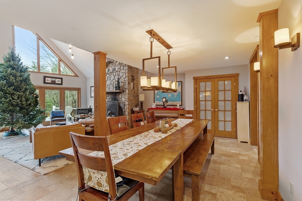 287 Chapman Road, Unit 1 Barre, MA 01005 - Photo 10 of 38 a dining room with furniture a chandelier and window