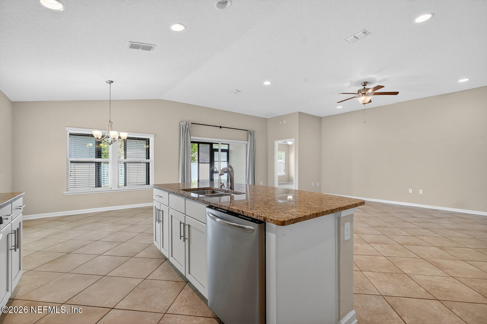 353 Green Turtle Lane St. Augustine, FL 32086 - Photo 20 of 48 a kitchen with stainless steel appliances granite countertop a sink stove and cabinets