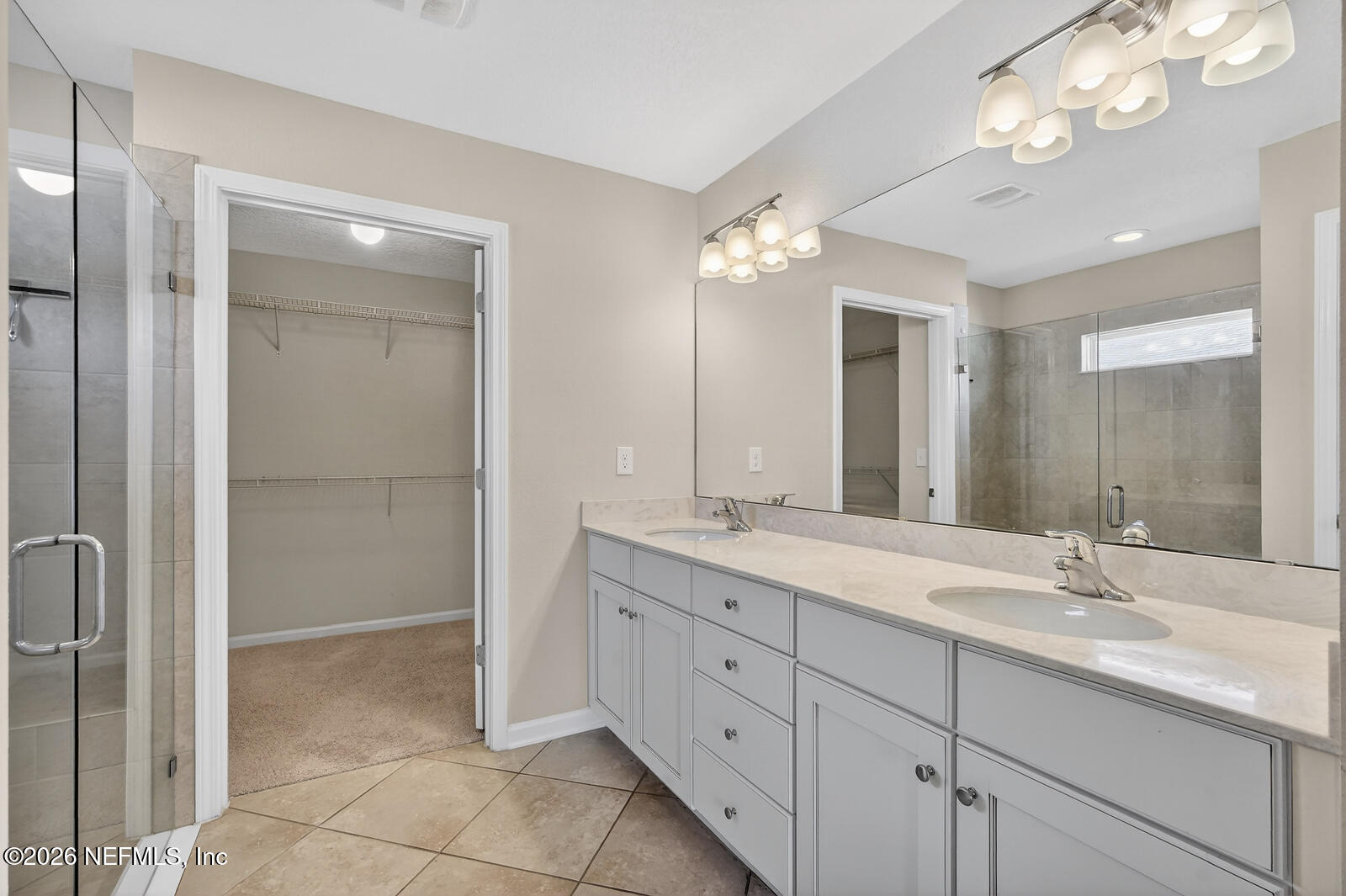 353 Green Turtle Lane St. Augustine, FL 32086 - Photo 24 of 48 a bathroom with a double vanity sink mirror and shower