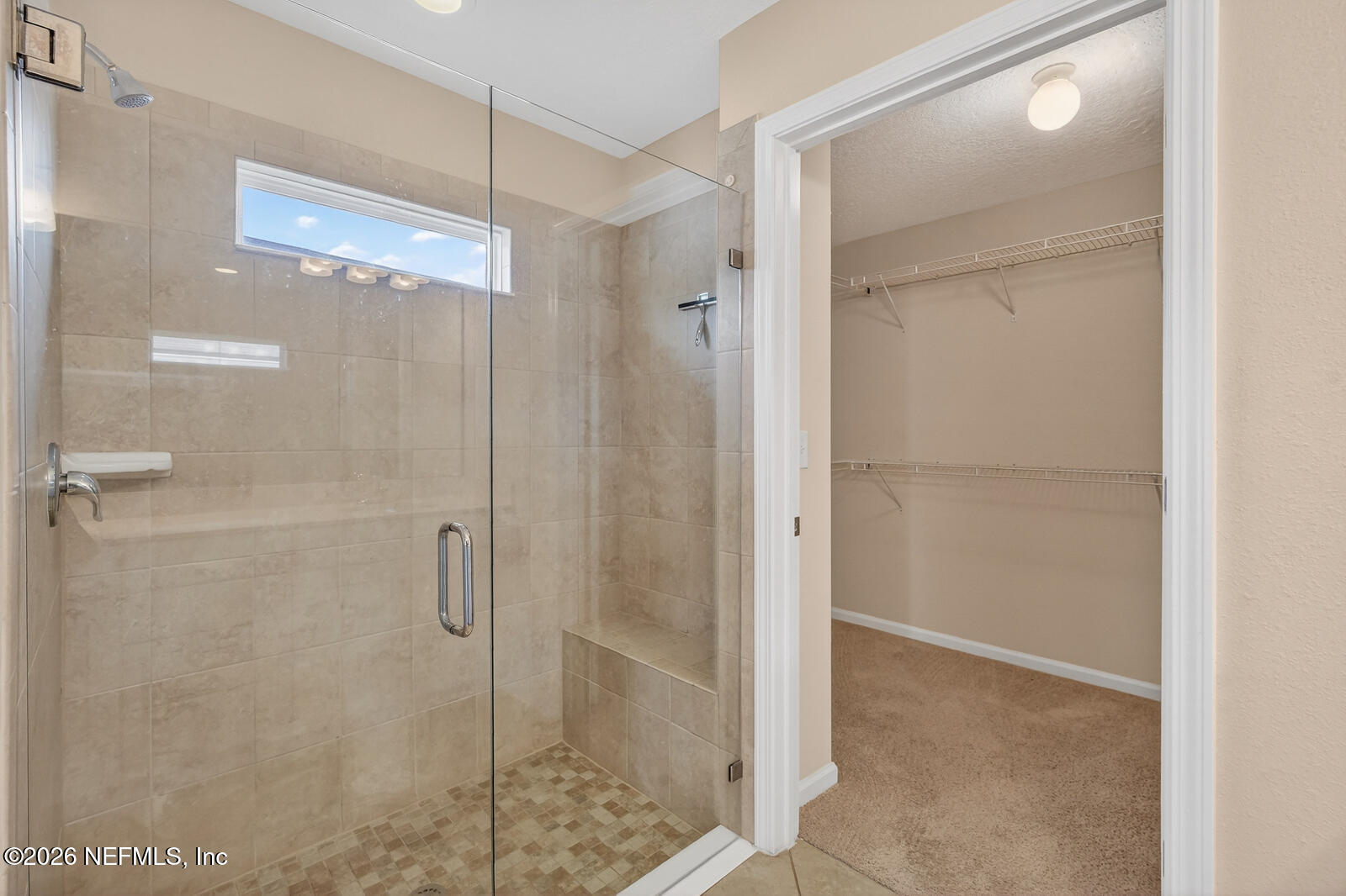 353 Green Turtle Lane St. Augustine, FL 32086 - Photo 30 of 48 a bathroom with a glass shower door