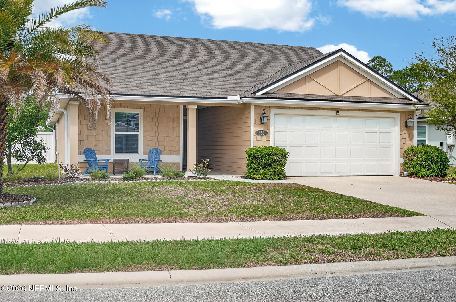353 Green Turtle Lane St. Augustine, FL 32086 - Photo 3 of 48 a front view of a house with a yard and garage