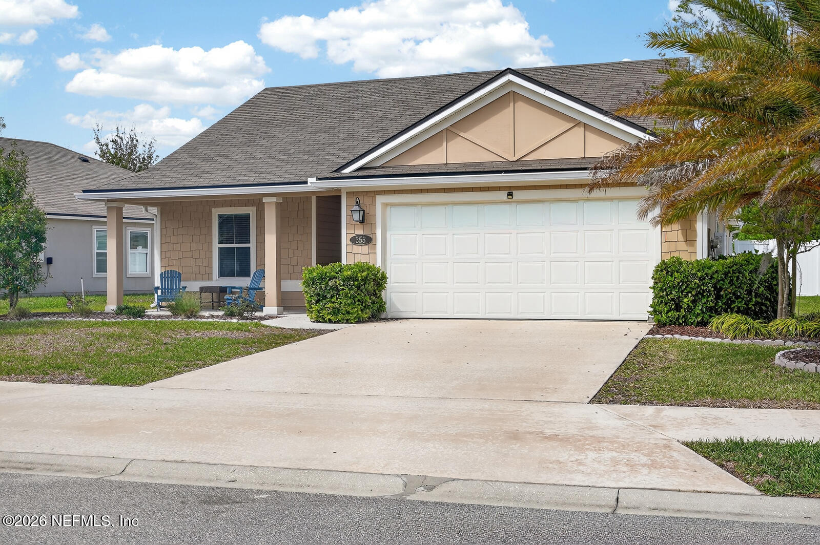 353 Green Turtle Lane St. Augustine, FL 32086 - Photo 4 of 48 a front view of a house with a yard and garage