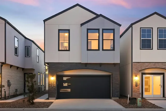 a front view of a house with parking