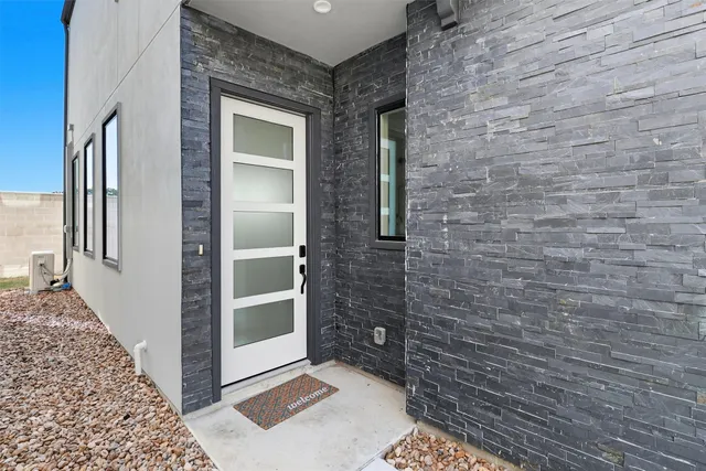 a bathroom with a shower and mirror