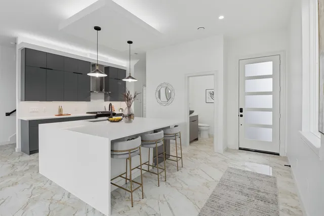 a kitchen with a sink and a stove top oven