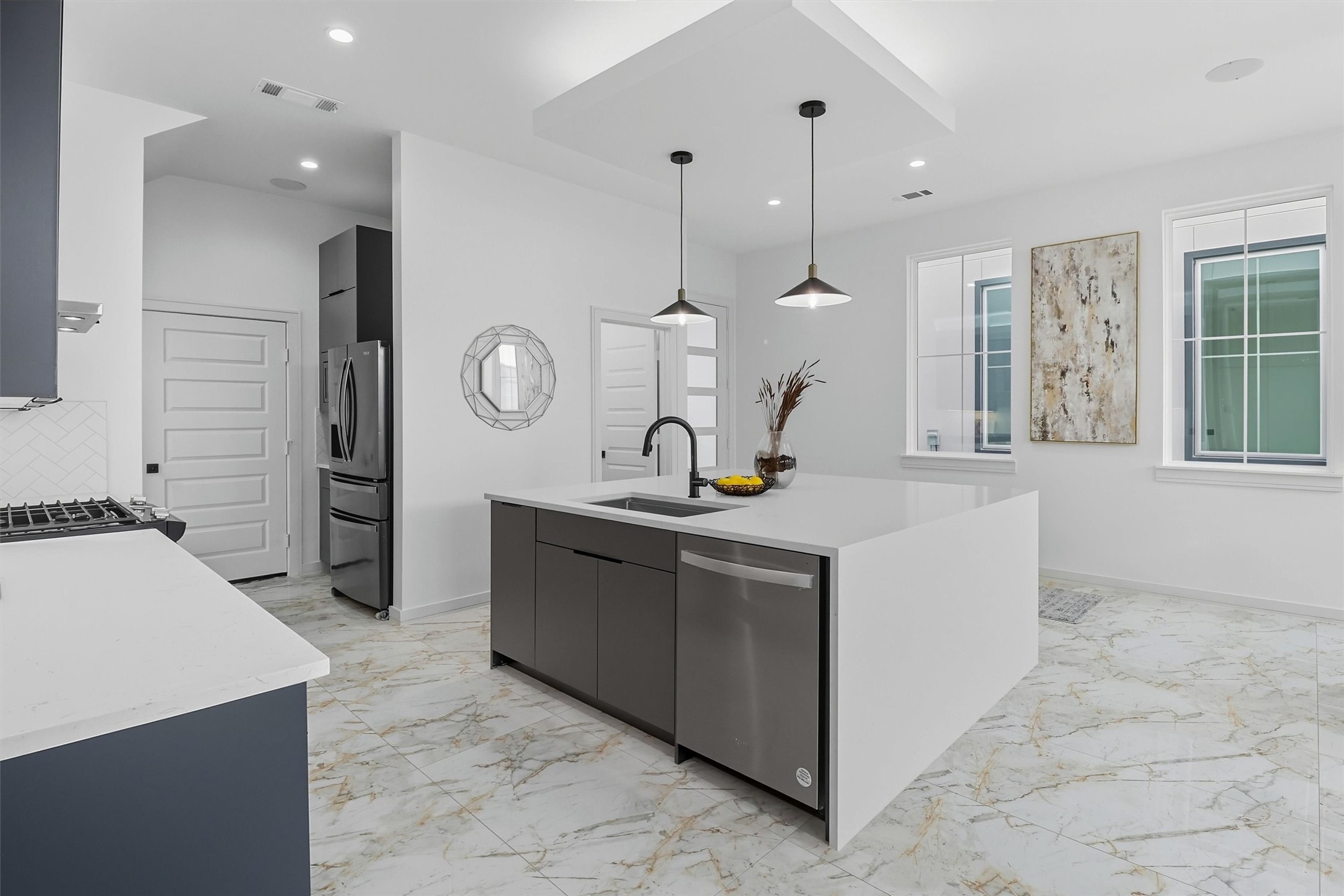2939 El Fenice Lane Houston, TX 77057 - Photo 15 of 48 a kitchen with a sink and a stove top oven