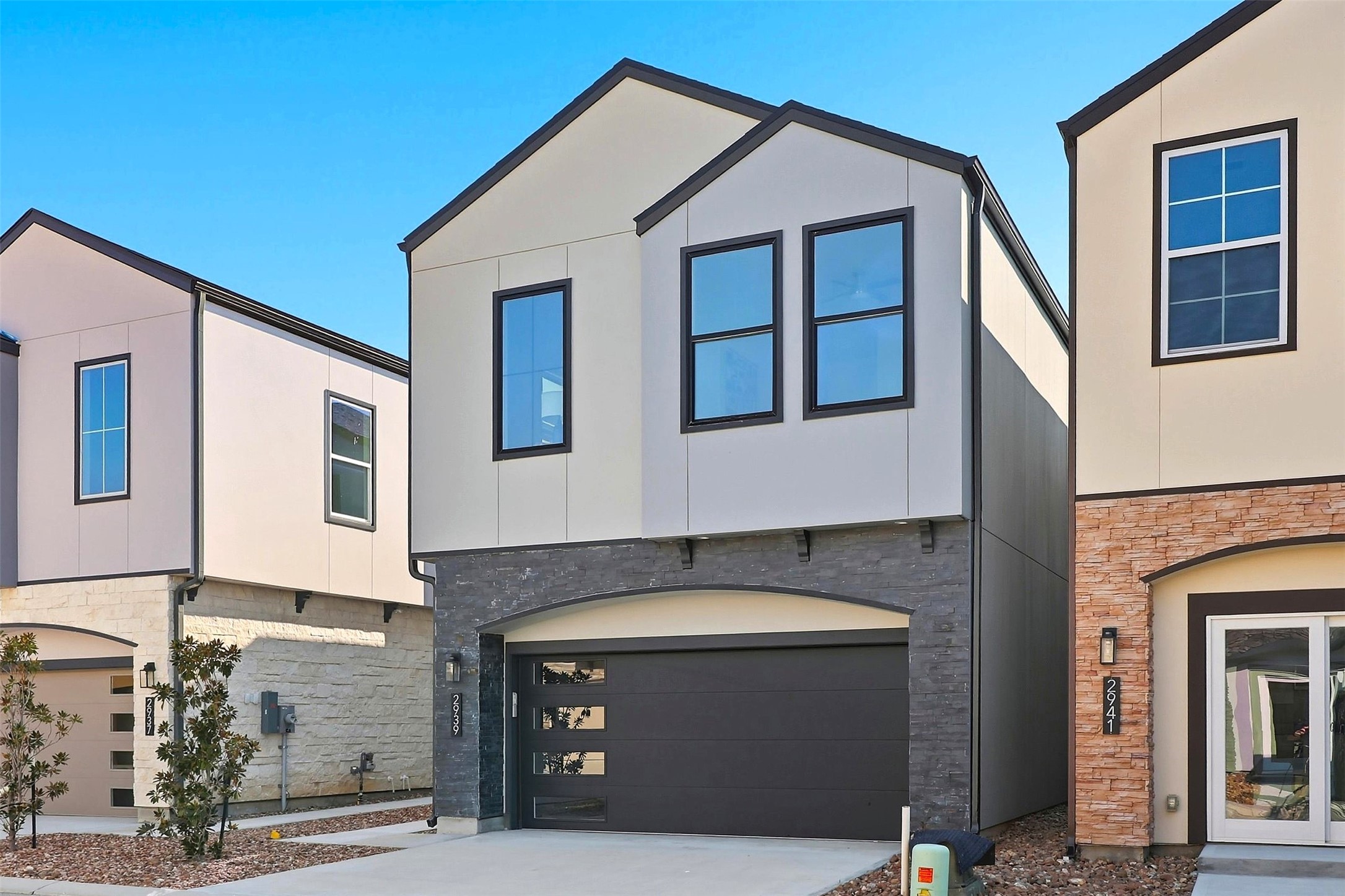 2939 El Fenice Lane Houston, TX 77057 - Photo 2 of 48 a front view of a house with a garage