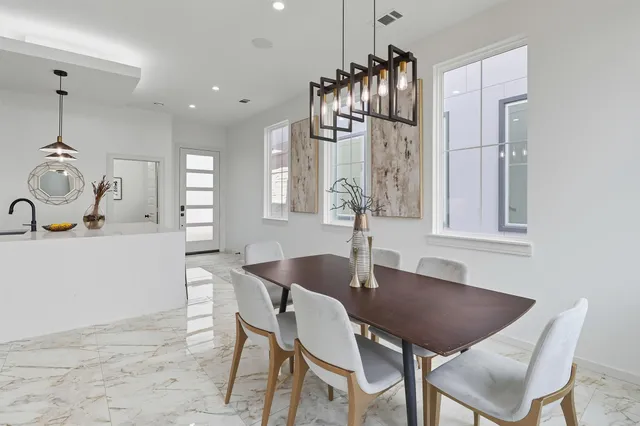 a living room with furniture and a mirror