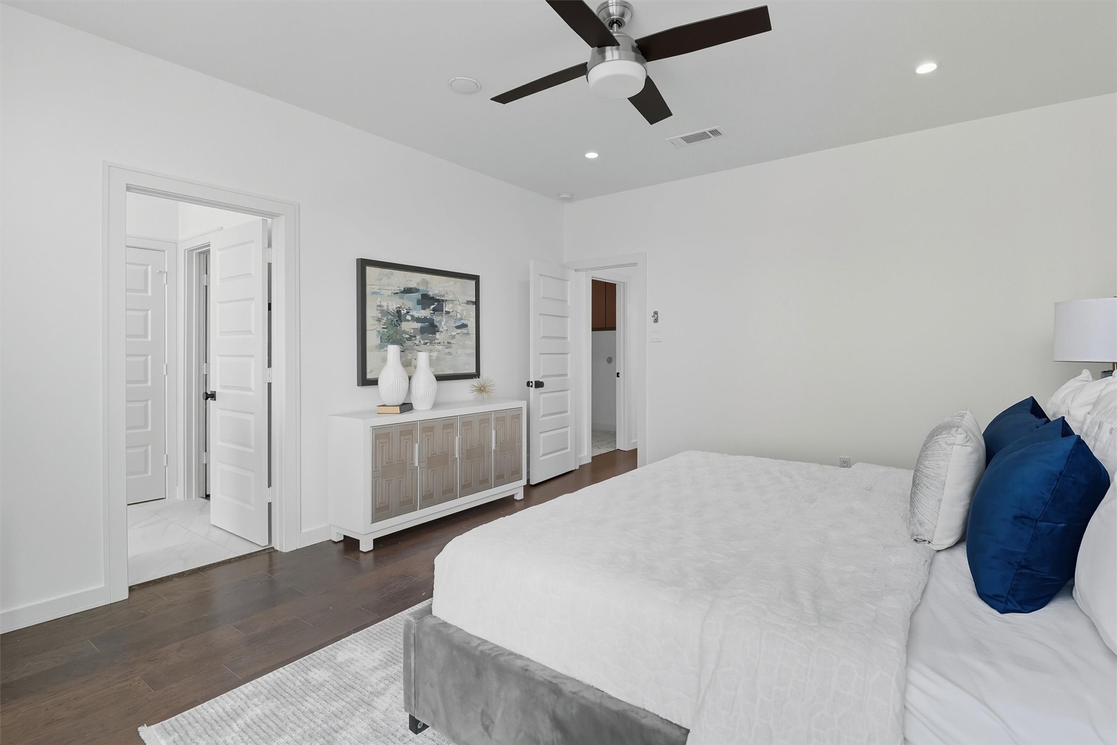 2939 El Fenice Lane Houston, TX 77057 - Photo 28 of 48 a bedroom with a bed and a chandelier