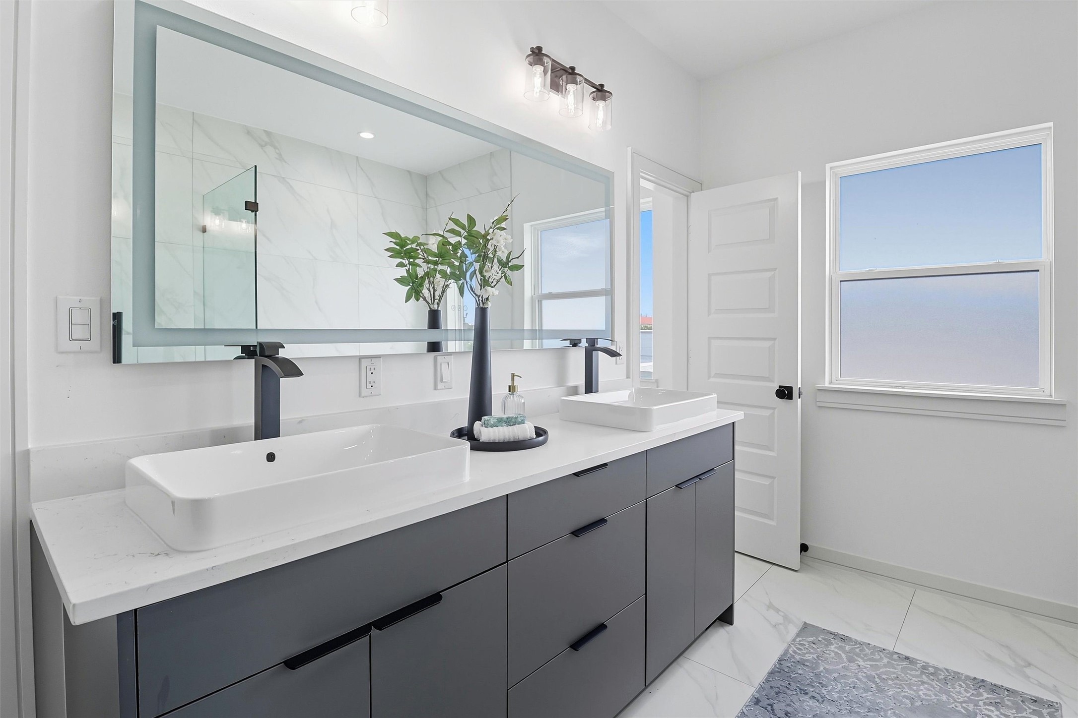 2939 El Fenice Lane Houston, TX 77057 - Photo 29 of 48 a bathroom with a sink and a mirror