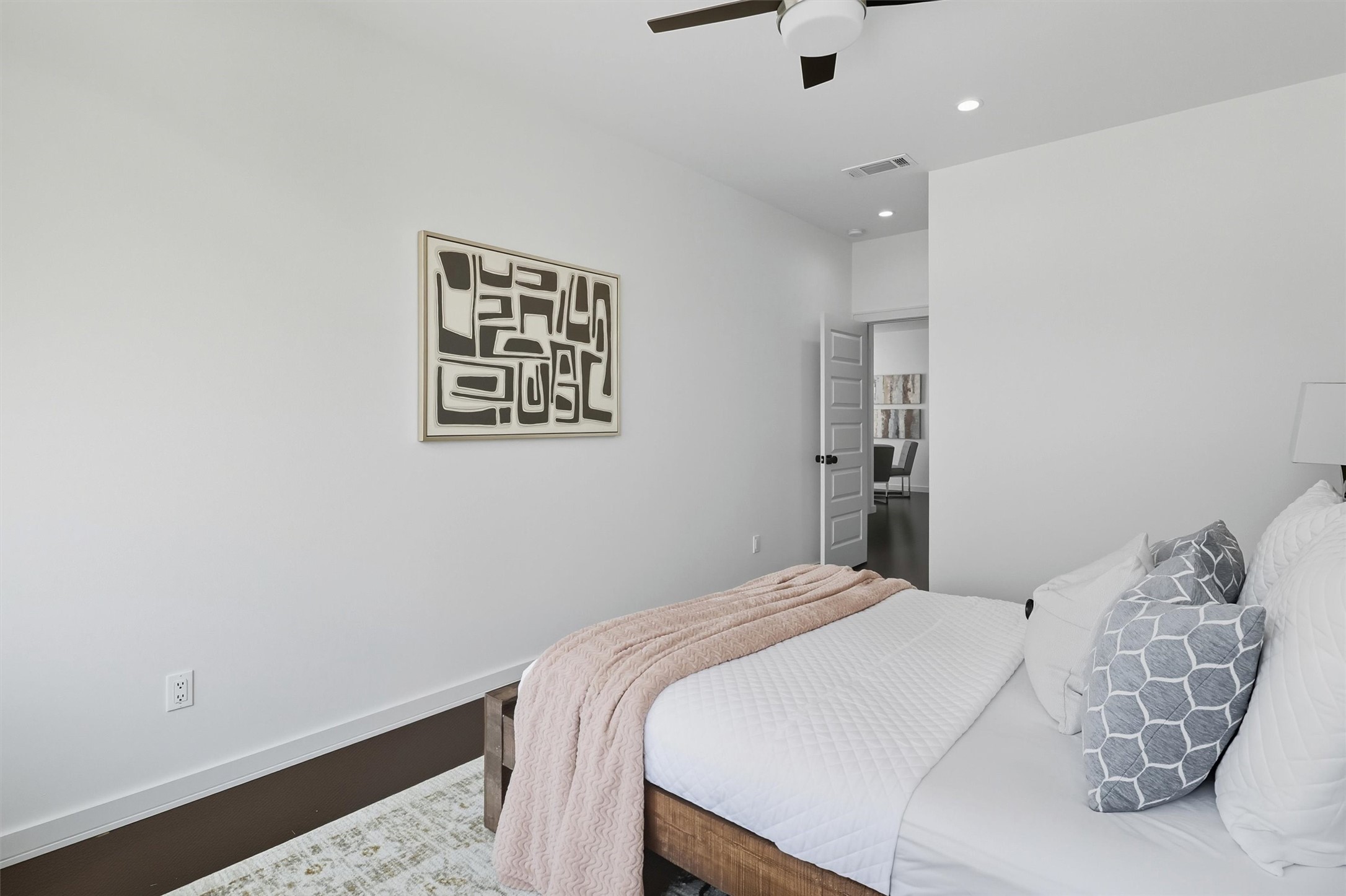 2939 El Fenice Lane Houston, TX 77057 - Photo 39 of 48 a bedroom with a bed and a painting on the wall